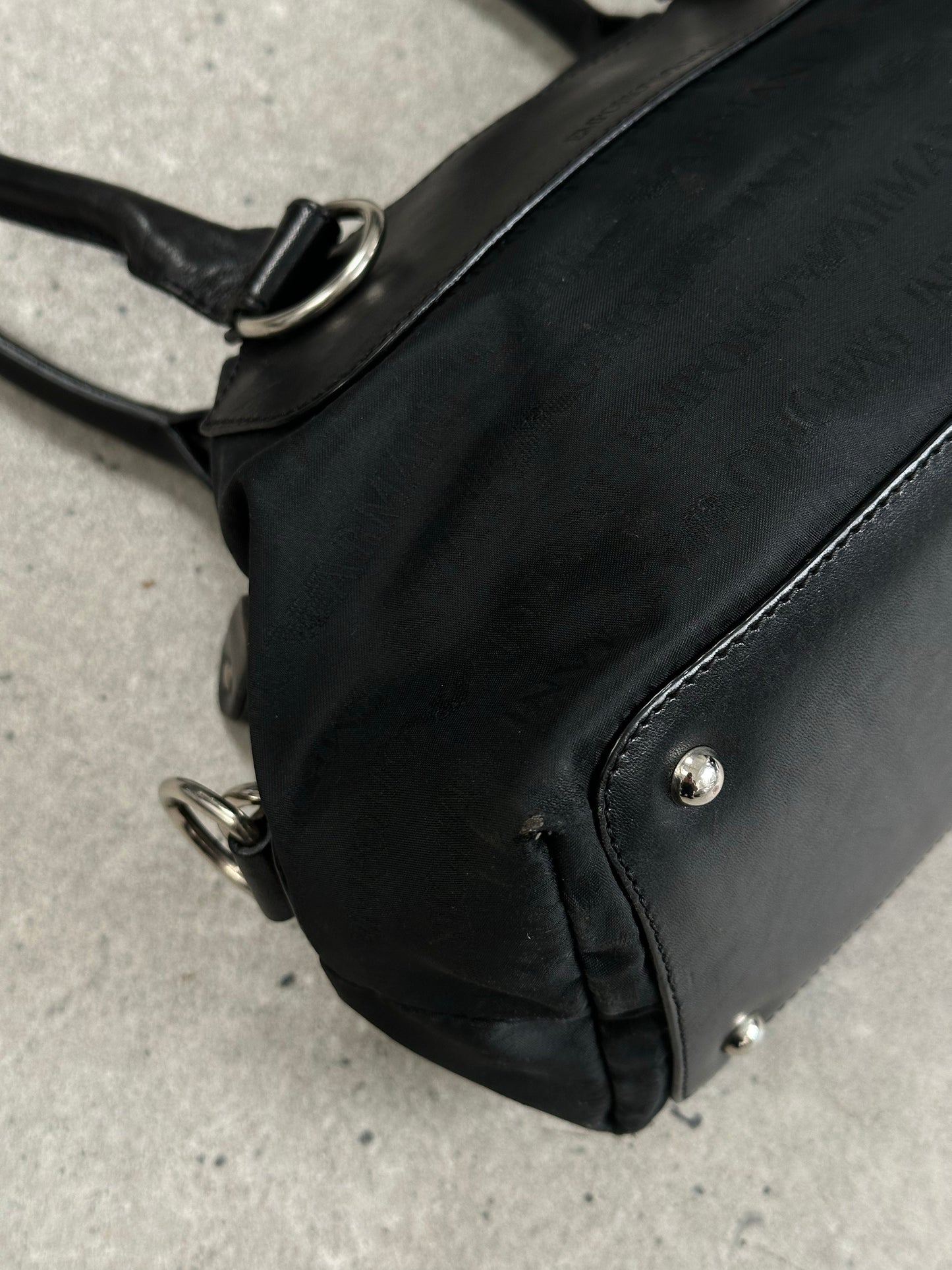 Emporio Armani 2000s nylon monogram shoulder bag with adjustable strap and logo detail, showcasing a sleek, vintage-inspired design.