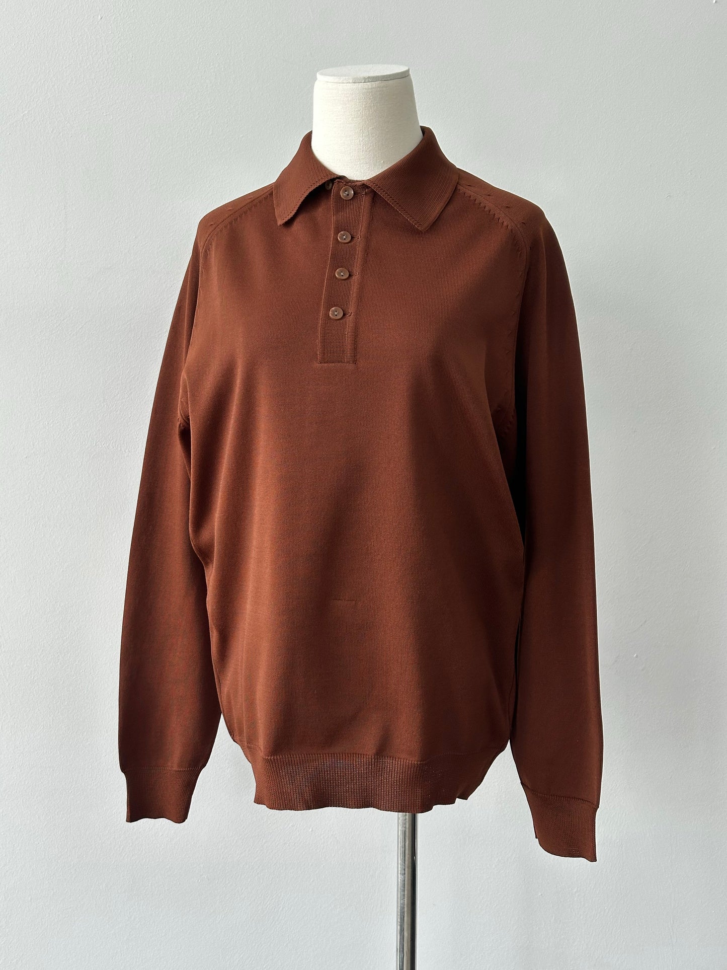 Vintage 1990s button neck polo jumper in classic style, featuring a polo shirt design with a buttoned collar and retro aesthetic.