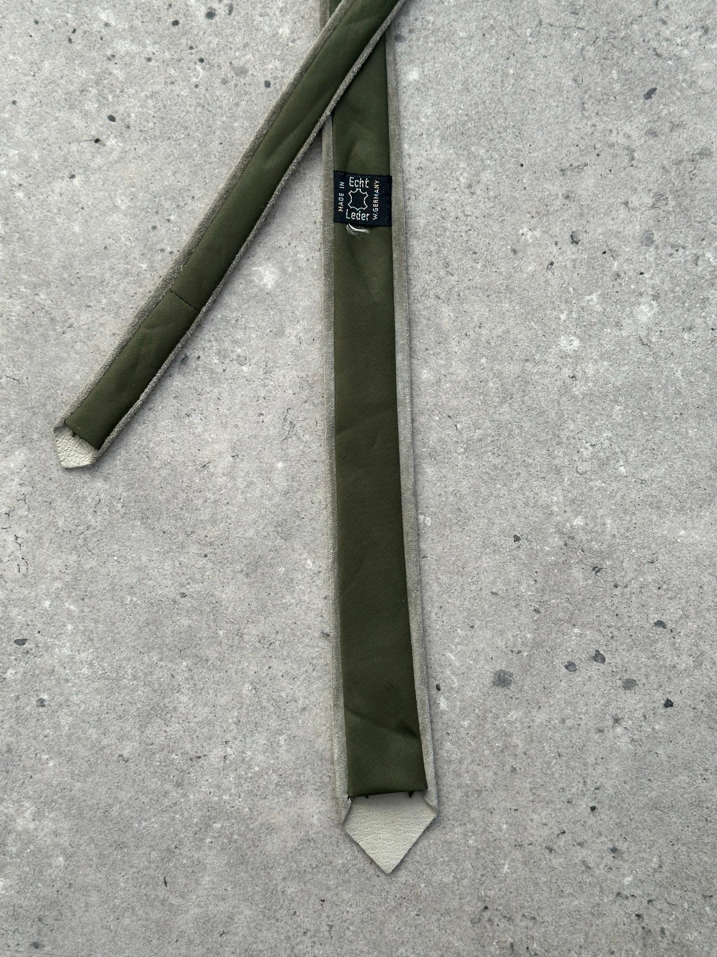 Vintage 1990s suede skinny tie, stylish accessory with textured suede fabric and narrow design, ideal for retro fashion looks.