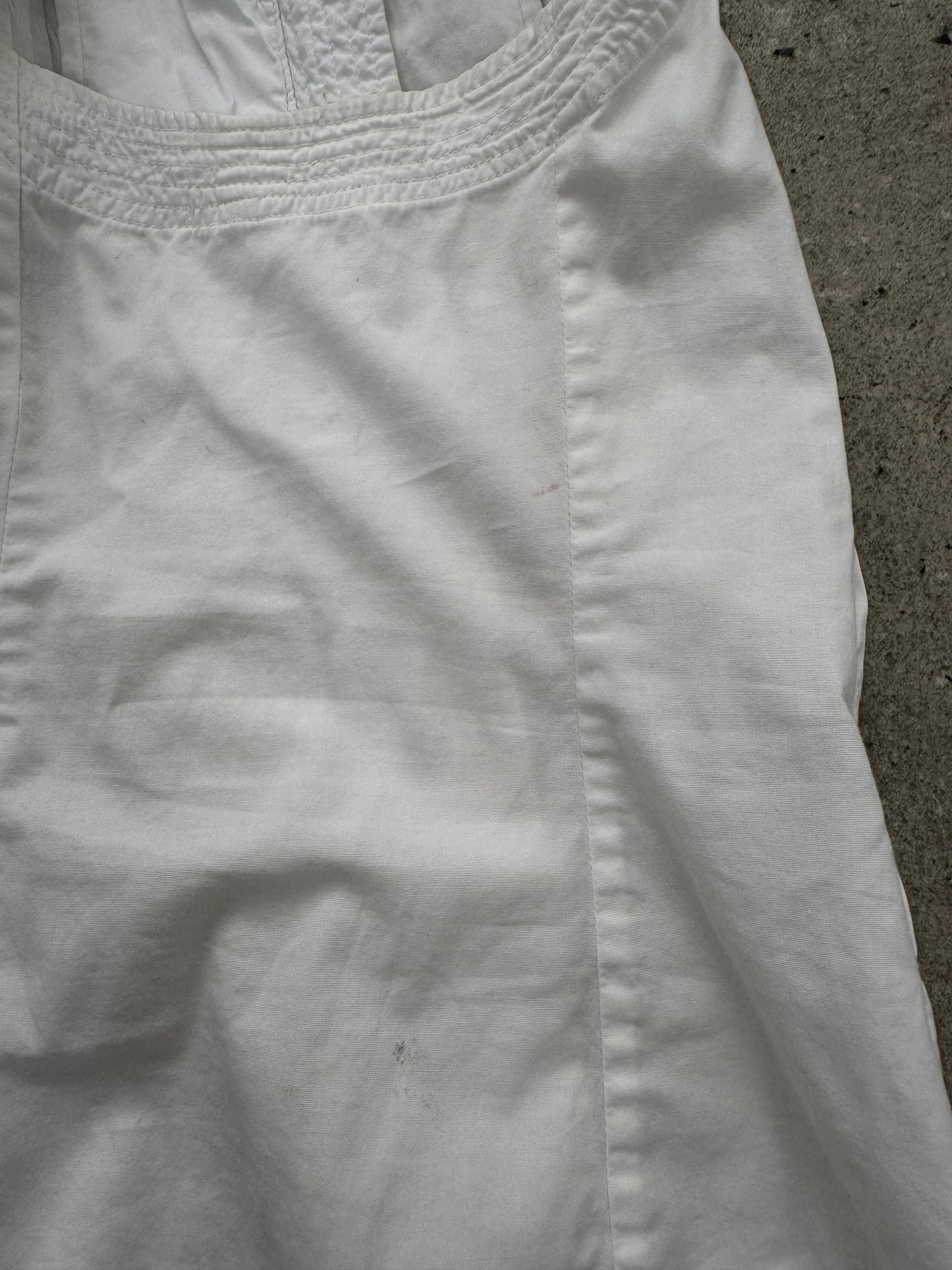 DKNY 2000s pleated cotton sleeveless top in white, showing its classic design and lightweight fabric.