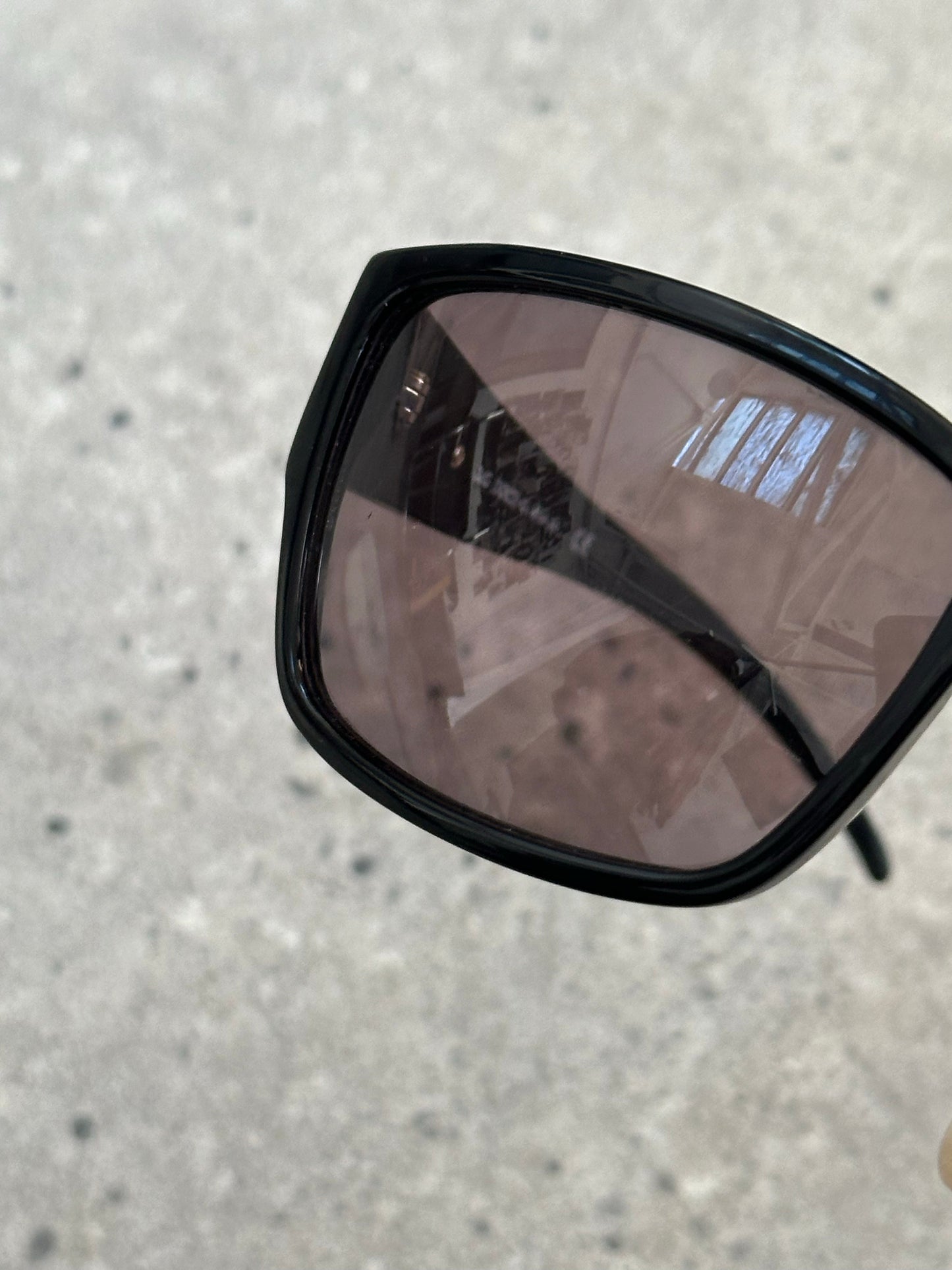 Dolce & Gabbana 2000s rectangle logo sunglasses with dark tinted lenses and stylish black frames.