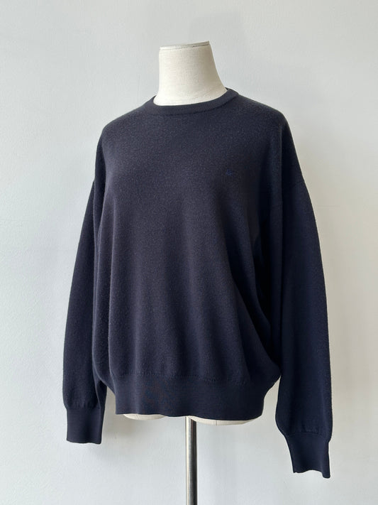 Burberrys 1990s merino wool logo jumper in size M, featuring classic branding and a cozy knit texture.