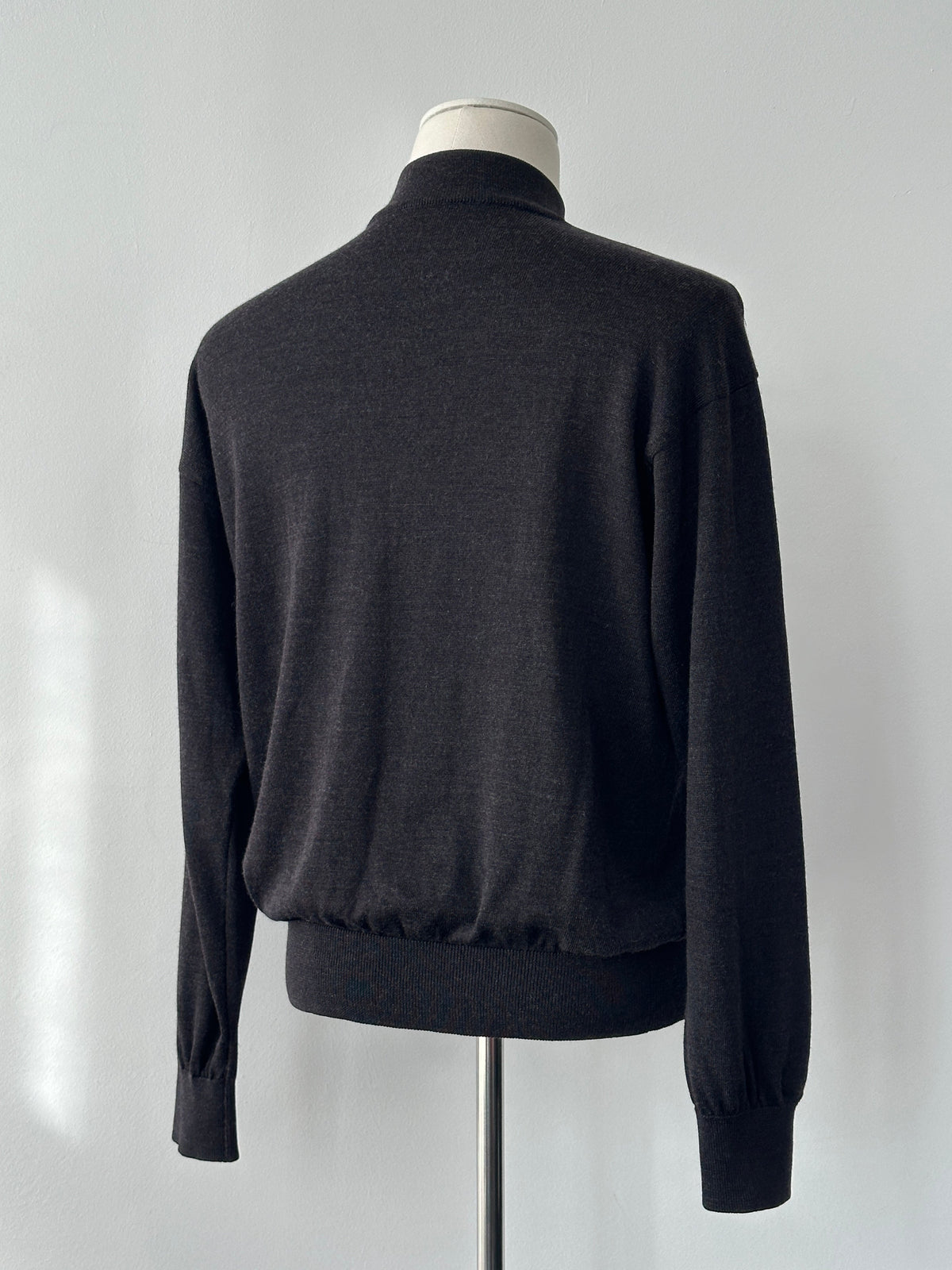 Yves Saint Laurent 1990s wool high neck jumper in size M, featuring a classic high neckline and textured knit fabric.