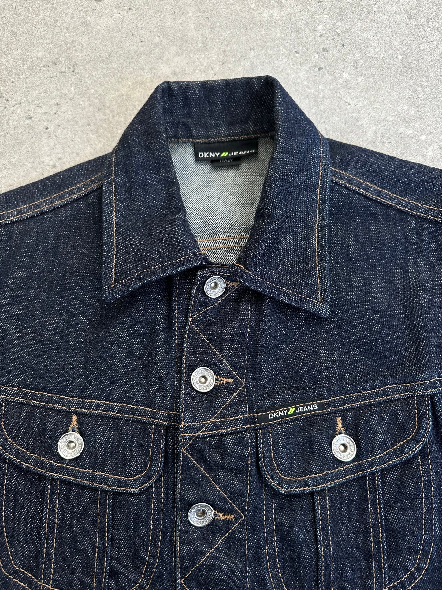 DKNY jeans 2000s fitted denim jacket in pure cotton, showcasing classic design and light-wash blue color with button closures.