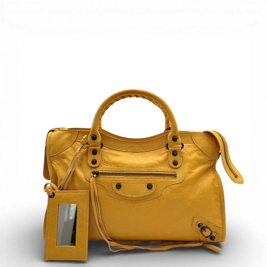https://cdn.shopify.com/s/files/1/0564/9376/8855/files/Balenciaga_Handtasche_Giant_City_aus_Leder_gelb_vintage_1135.webp?v=1770947793