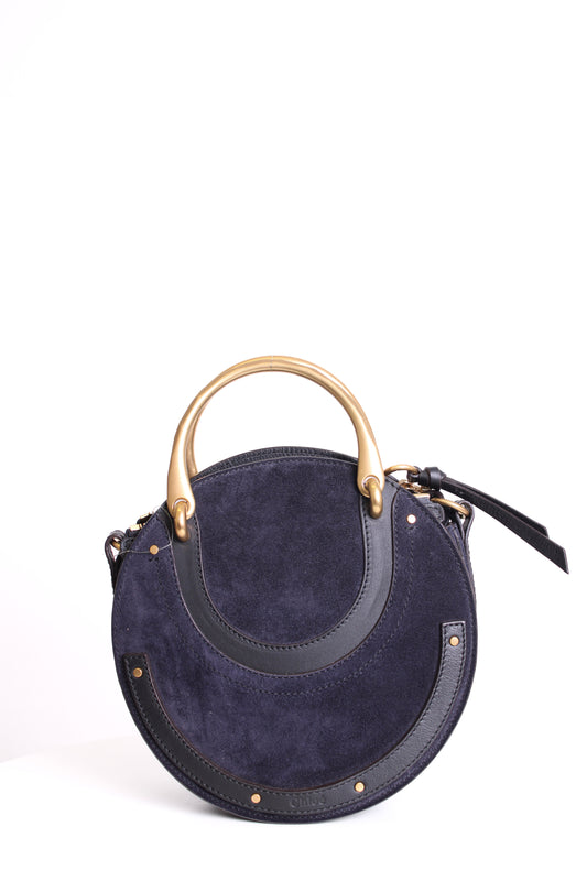 https://cdn.shopify.com/s/files/1/0770/3278/4192/files/Chloe_Pixie_Suede_Crossbody_Bag_Navy.jpg?v=1766440938
