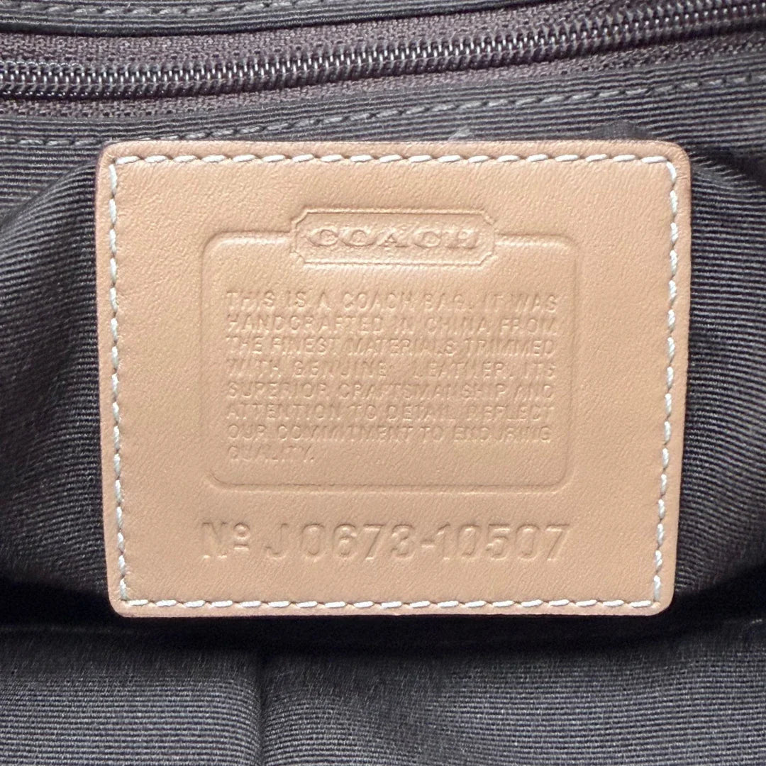 https://cdn.shopify.com/s/files/1/0564/9376/8855/files/Coach_Handtasche_Shopper_klein_Signature_beige_vintage7968.webp?v=1780489330