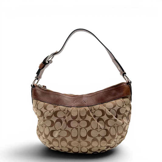 https://cdn.shopify.com/s/files/1/0564/9376/8855/files/Coach_Schultertasche_Signature_large_beige___braun_vintage8032.webp?v=1780489159