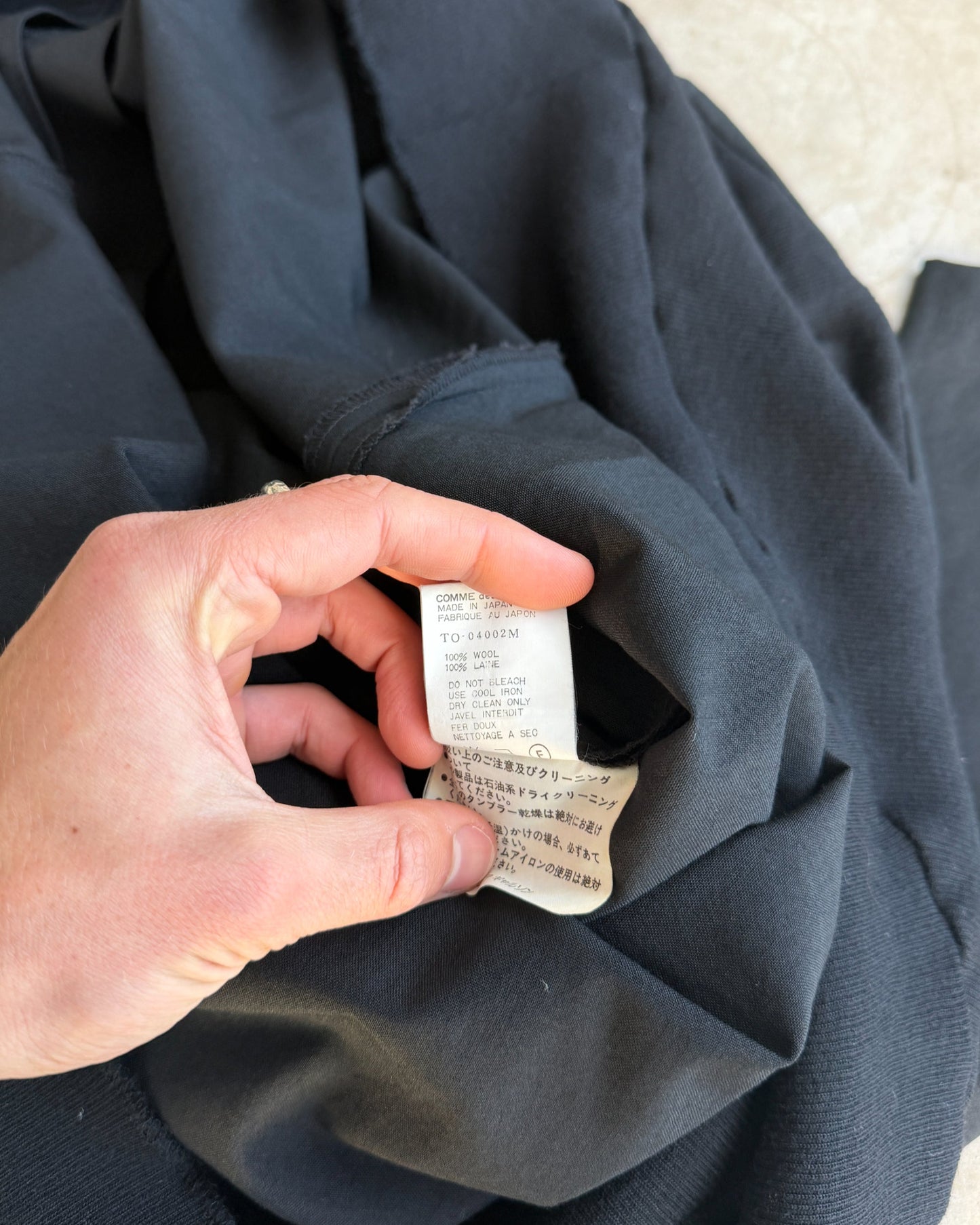 Comme des Garçons Tricot FW93 Wool Overcoat Dress – M-on a concrete background