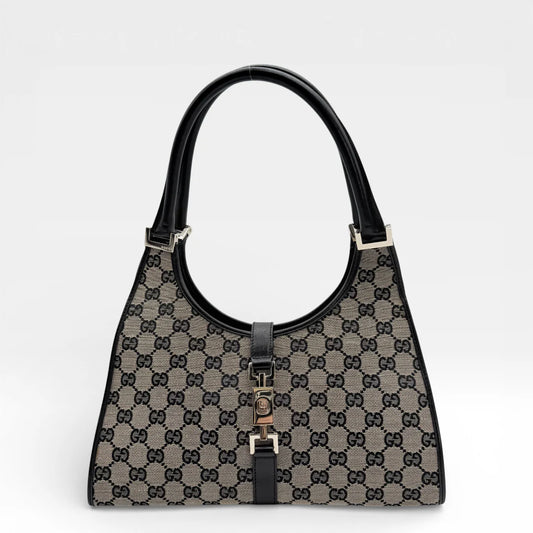 https://cdn.shopify.com/s/files/1/0564/9376/8855/files/Gucci_Handtasche_Jackie_medium_monogram_beige_vintage_GG_7286.webp?v=1767280782