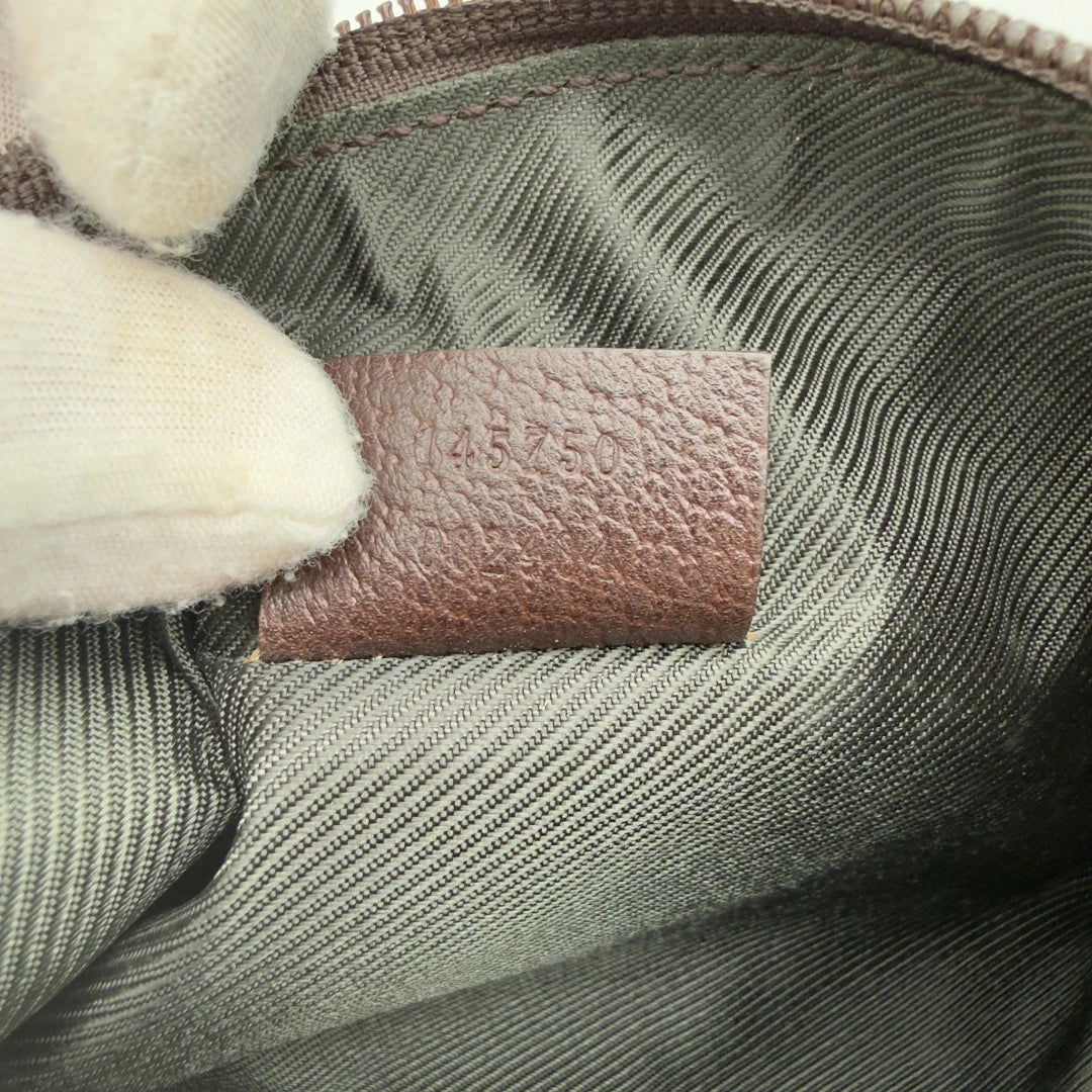 https://cdn.shopify.com/s/files/1/0564/9376/8855/files/Gucci_Pochette_Abbey_monogram_beige_14.webp?v=1782386168