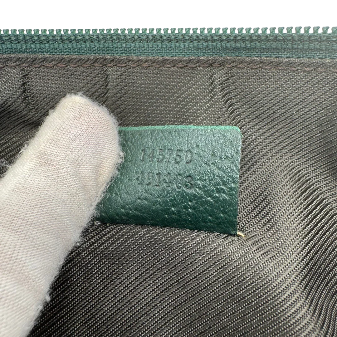 https://cdn.shopify.com/s/files/1/0564/9376/8855/files/Gucci_Pochette_Abbey_monogram_beige_vintage_GG1745.webp?v=1779408432