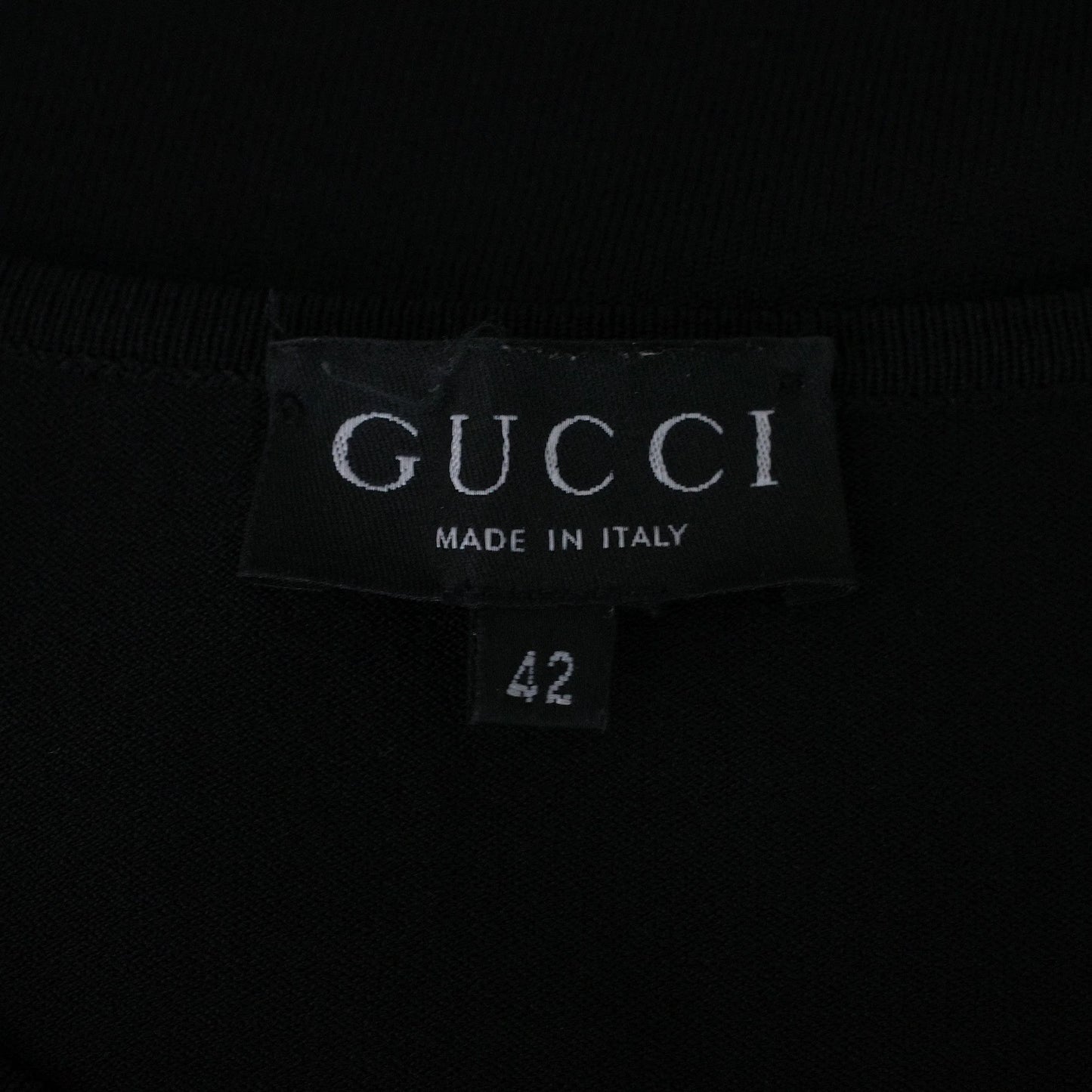 Gucci by Tom Ford SS 1998 viscose knit short sleeve top with a sleeve cutout featuring an engraved metal plate. Size IT 42 / UK 8-10.