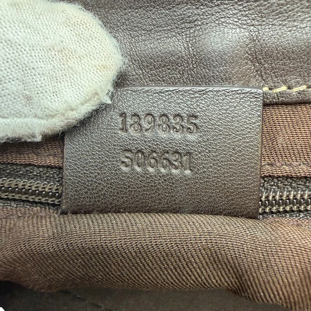 https://cdn.shopify.com/s/files/1/0564/9376/8855/files/Gucci_Schultertasche_D-Ring_large_monogram_beige_vintage_GG6978.webp?v=1779289890