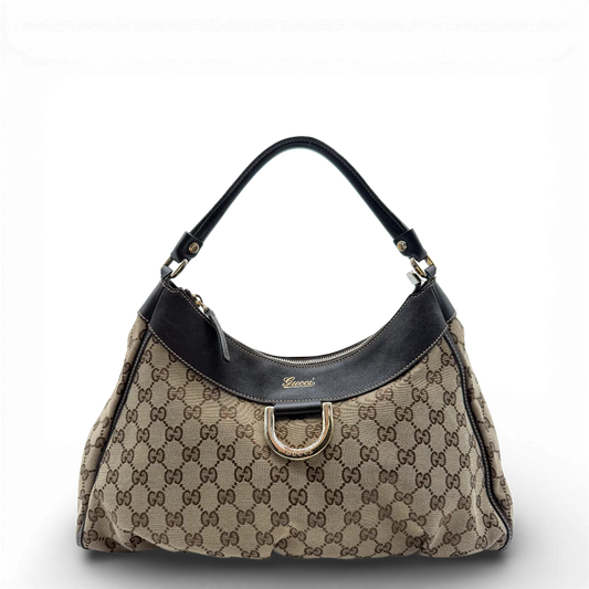 https://cdn.shopify.com/s/files/1/0564/9376/8855/files/Gucci_Schultertasche_D-Ring_large_monogram_beige_vintage_GG_0712.webp?v=1772111312