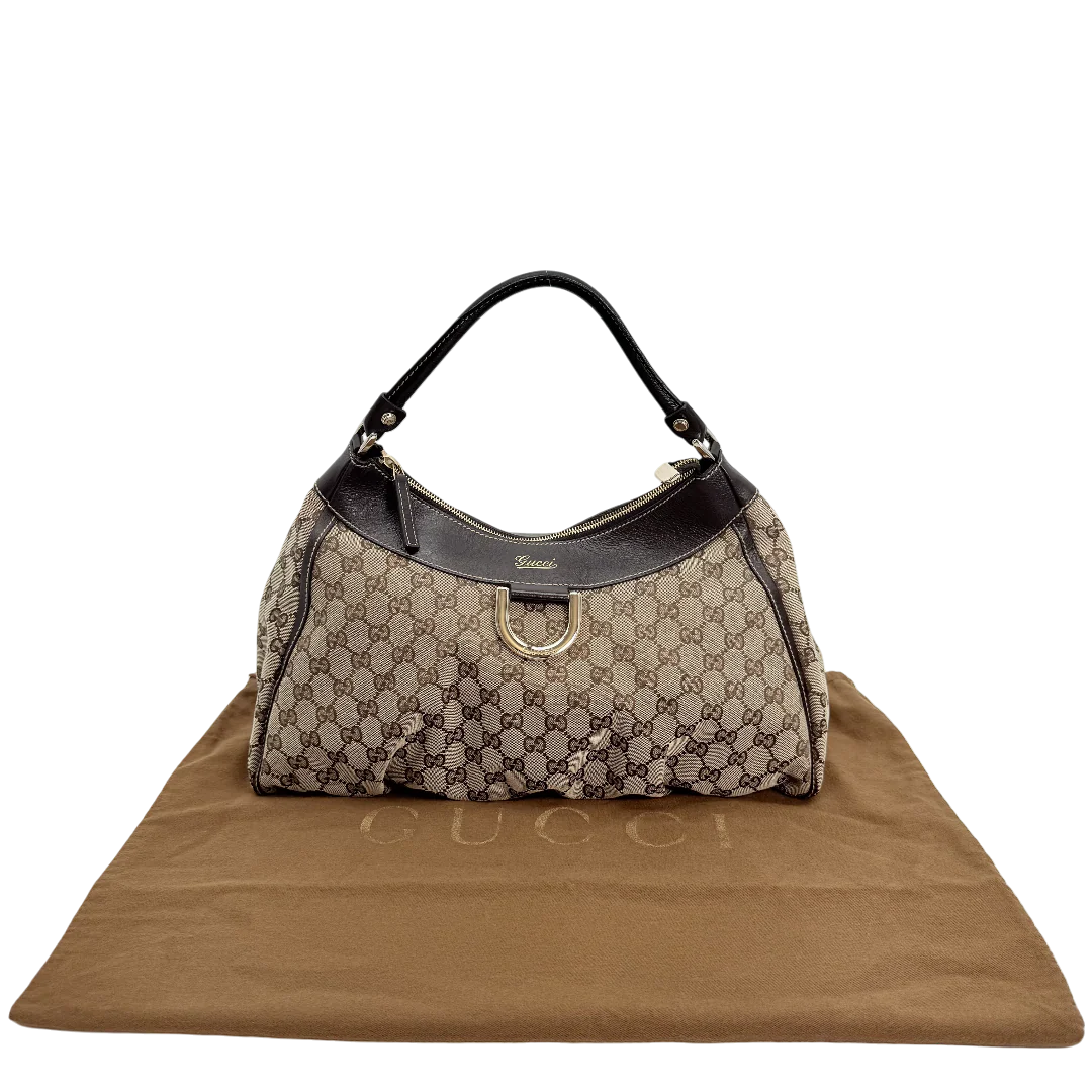 https://cdn.shopify.com/s/files/1/0564/9376/8855/files/Gucci_Schultertasche_D-Ring_large_monogram_beige_vintage_GG_0835.webp?v=1770828768