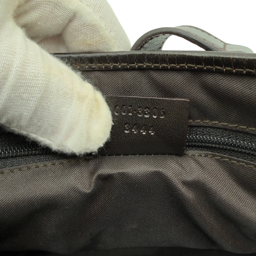 https://cdn.shopify.com/s/files/1/0564/9376/8855/files/Gucci_Schultertasche_Jackie_Sherry_Line_monogram_beige_vintage_GG7477.webp?v=1779290407