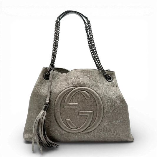 https://cdn.shopify.com/s/files/1/0564/9376/8855/files/Gucci_Shopper_Soho_mit_Umhangekette_aus_Leder_gold_vintage_GG2411.webp?v=1773326046
