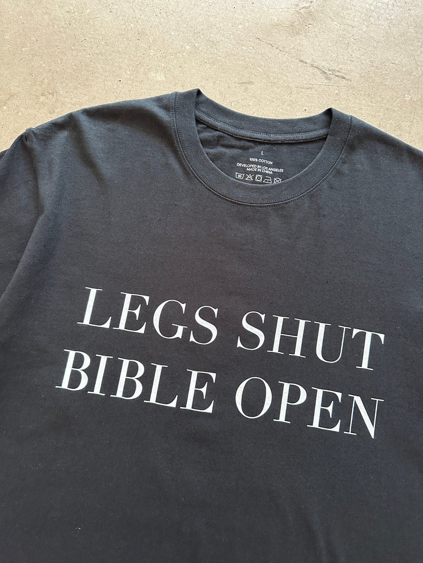 Permanent Orbit Legs Shut Bible Open T-Shirt | Large, TBD
