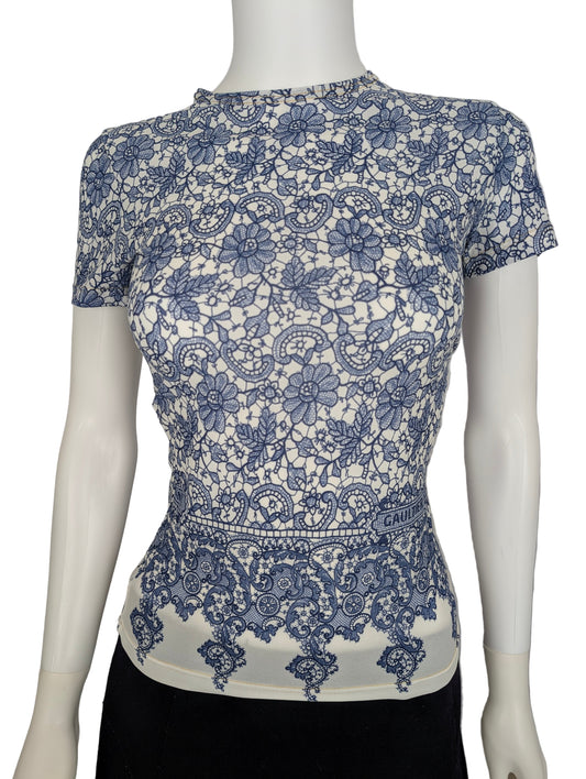 https://cdn.shopify.com/s/files/1/0900/2729/5066/files/Jean_Paul_Gaultier_JPG_Jeans_Lace_Print_Top.jpg?v=1768419675