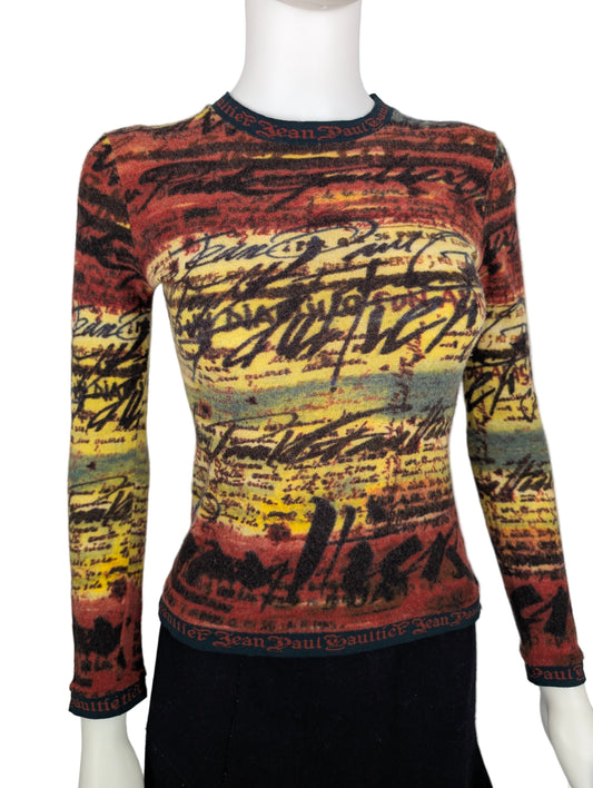 https://cdn.shopify.com/s/files/1/0900/2729/5066/files/Jean_Paul_Gaultier_Knit_Script_Top.jpg?v=1768420183