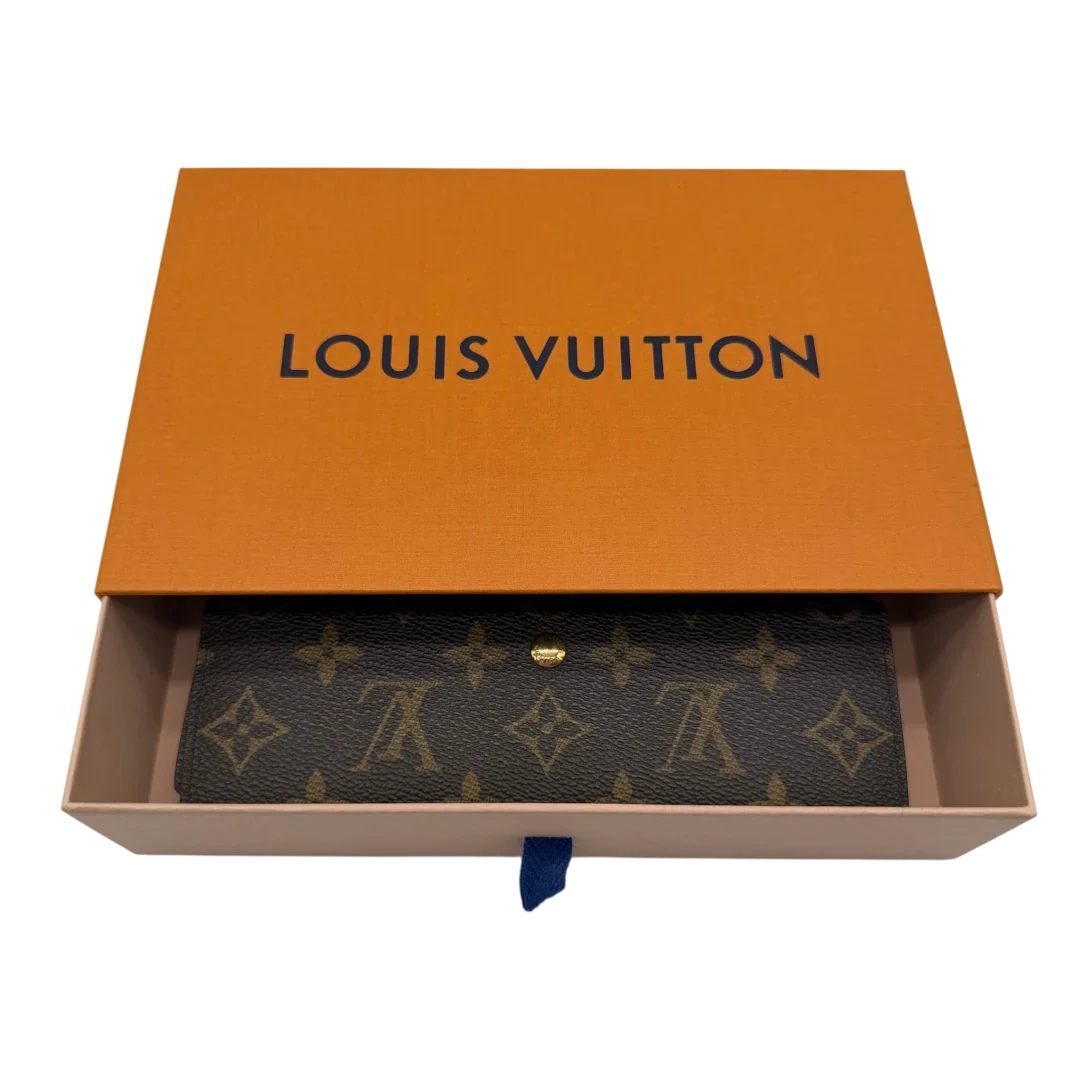 https://cdn.shopify.com/s/files/1/0564/9376/8855/files/Louis_Vuitton_Geldbeutel_International_monogram_braun_LV2402.webp?v=1773325140