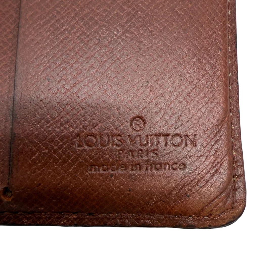 https://cdn.shopify.com/s/files/1/0564/9376/8855/files/Louis_Vuitton_Geldbeutel_Portefeuille_monogram_braun_vintage_LV7761.webp?v=1780487841