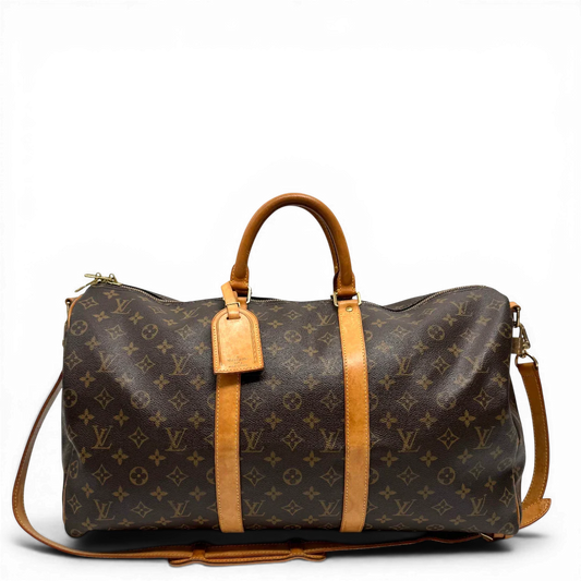 https://cdn.shopify.com/s/files/1/0564/9376/8855/files/Louis_Vuitton_Reisetasche_Keepall_55_Bandouliere_monogram_braun_vintage_LV0192.webp?v=1775655681
