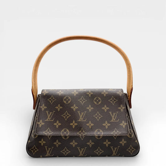 https://cdn.shopify.com/s/files/1/0564/9376/8855/files/Louis_Vuitton_Schultertasche_Mini_Looping_monogram_braun_vintage_LV_8563.webp?v=1768480193