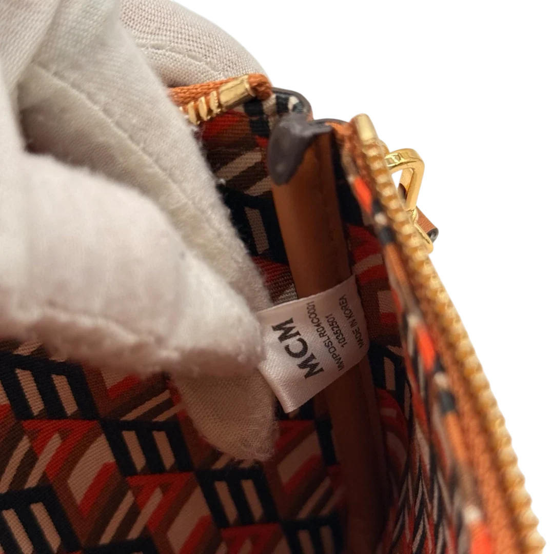 https://cdn.shopify.com/s/files/1/0564/9376/8855/files/MCM_Pochette_small_visetos_braun_18.webp?v=1784804533