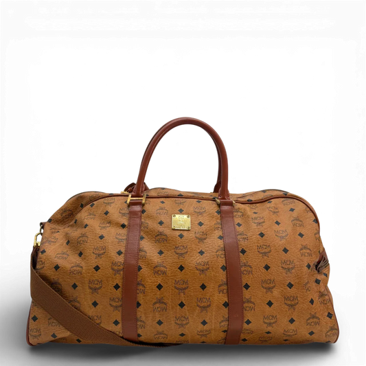https://cdn.shopify.com/s/files/1/0564/9376/8855/files/Mcm_Reisetasche_55_mit_Schultergurt_Visetos_braun_vintage_1585.webp?v=1772706878