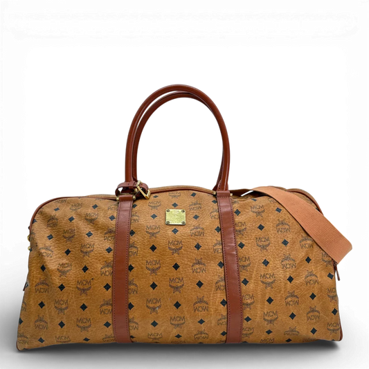 https://cdn.shopify.com/s/files/1/0564/9376/8855/files/Mcm_Reisetasche_55_mit_Schultergurt_Visetos_braun_vintage_2816.webp?v=1772707822