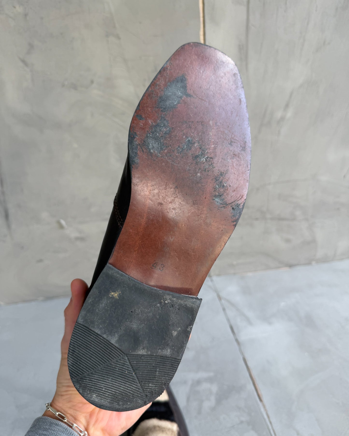 Manock Zebra Skin Loafers – EU 43-on a concrete background