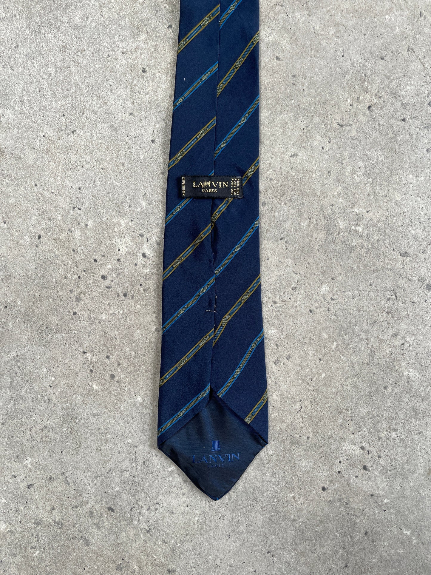 Lanvin Paris 1990s pure silk striped tie featuring classic blue and white pattern, showcasing elegant craftsmanship and timeless style.