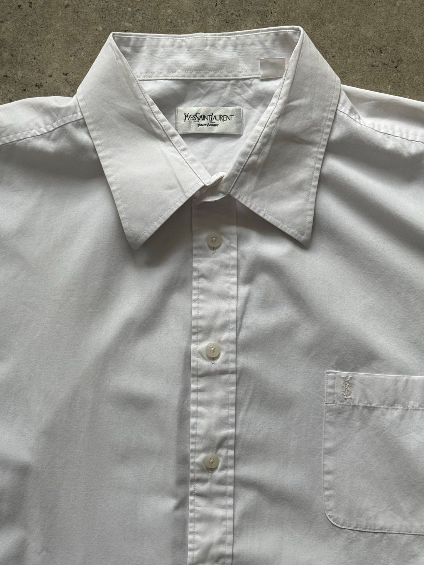 Yves Saint Laurent Pour Homme 1990s cotton short sleeve logo shirt in XXL, white with YSL branding on the front.