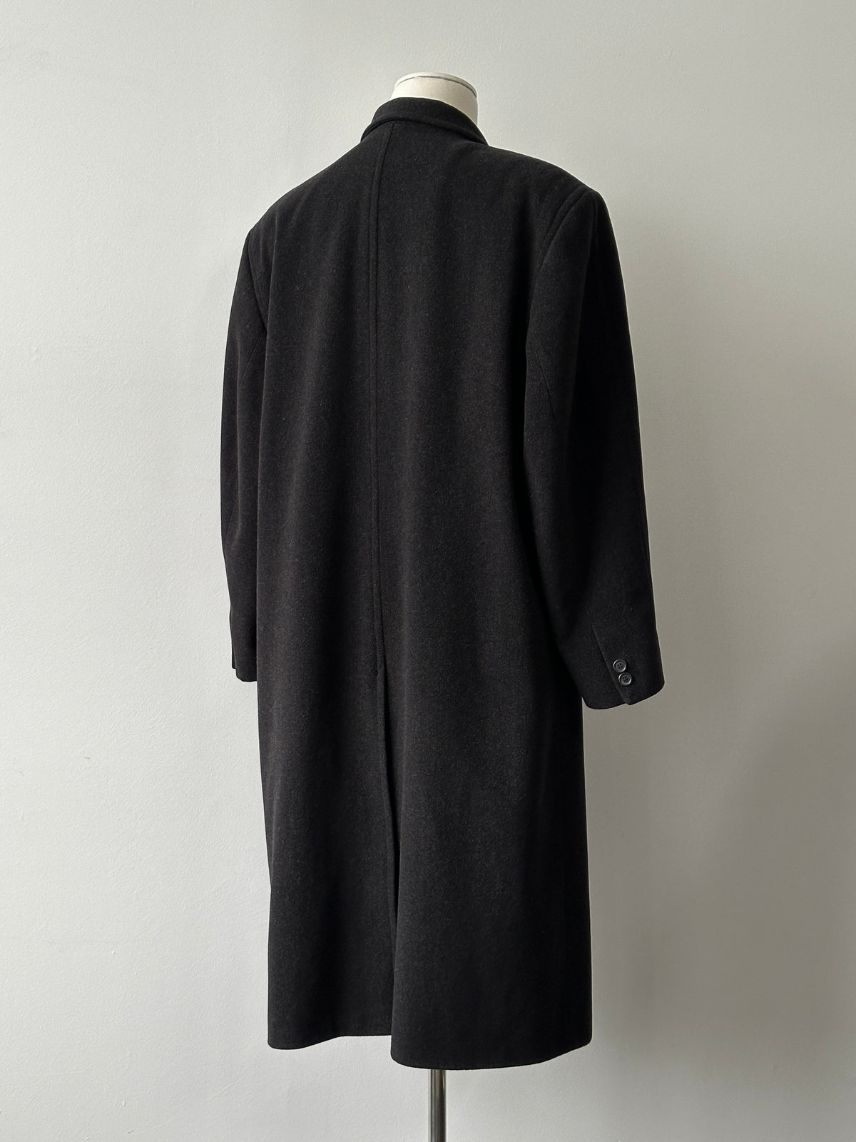 Vintage 1990s pure wool double-breasted coat in XL, showing classic design and textured wool fabric.