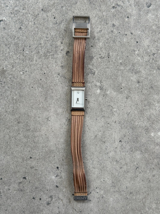 Donna Karran DKNY 2000s leather rectangular quartz watch with a sleek black leather strap and silver-tone rectangular face.