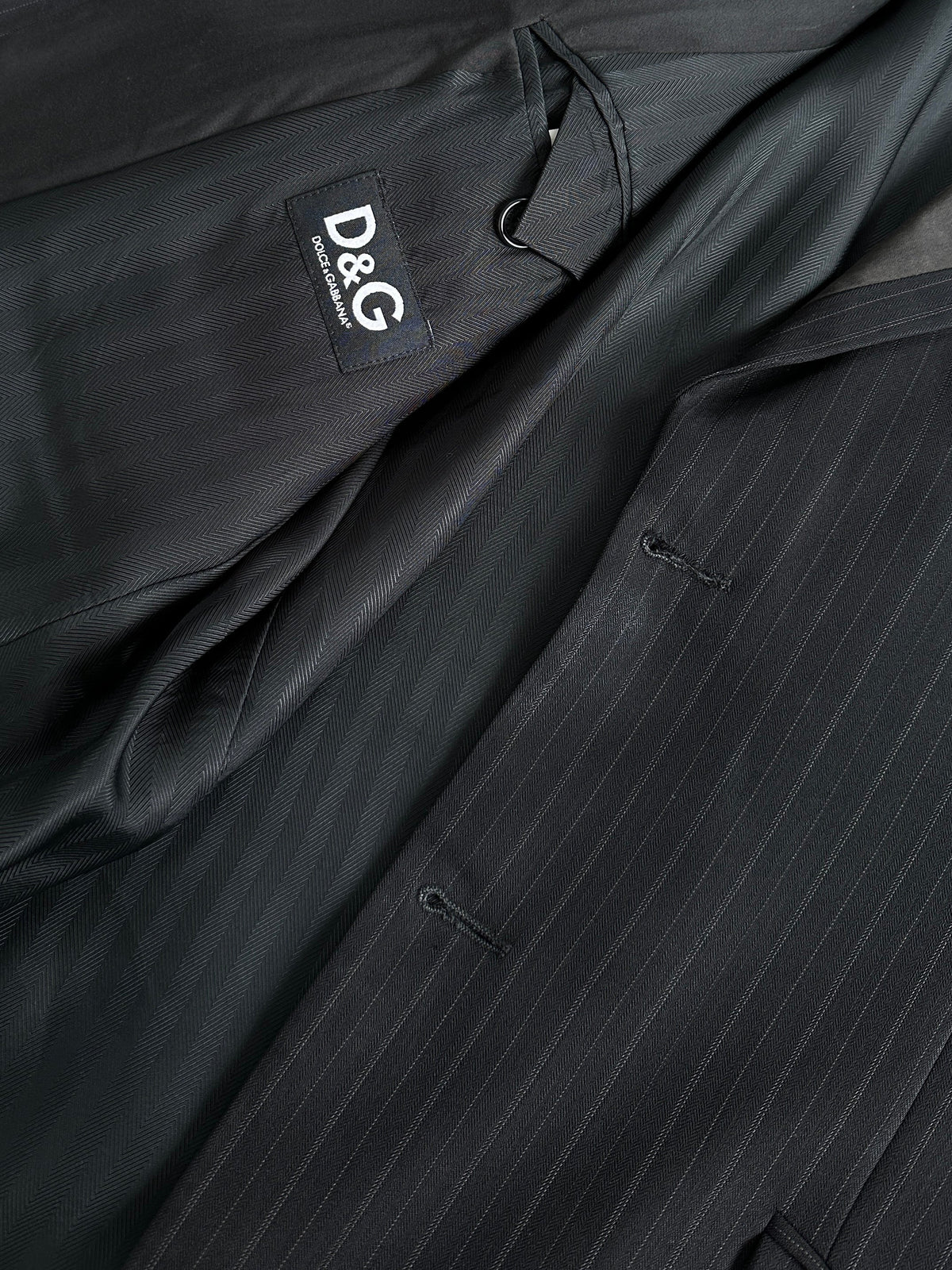 Dolce & Gabbana 1990s pure wool stripe tuxedo blazer in size L, black and white tailored blazer with notch lapels and button closure.