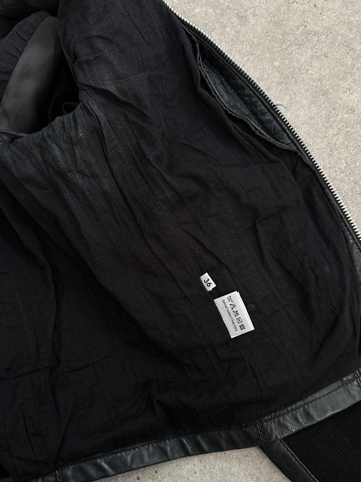 Vintage 2000s fitted moto leather jacket in lamb leather, XS size, featuring classic design and zippered front.