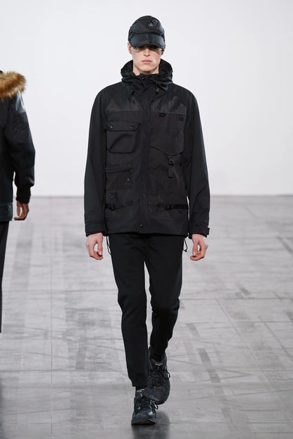 https://cdn.shopify.com/s/files/1/0821/7405/0644/files/00029-junya-watanabe-fall-2023-menswear-credit-gorunway.webp?v=1770765737