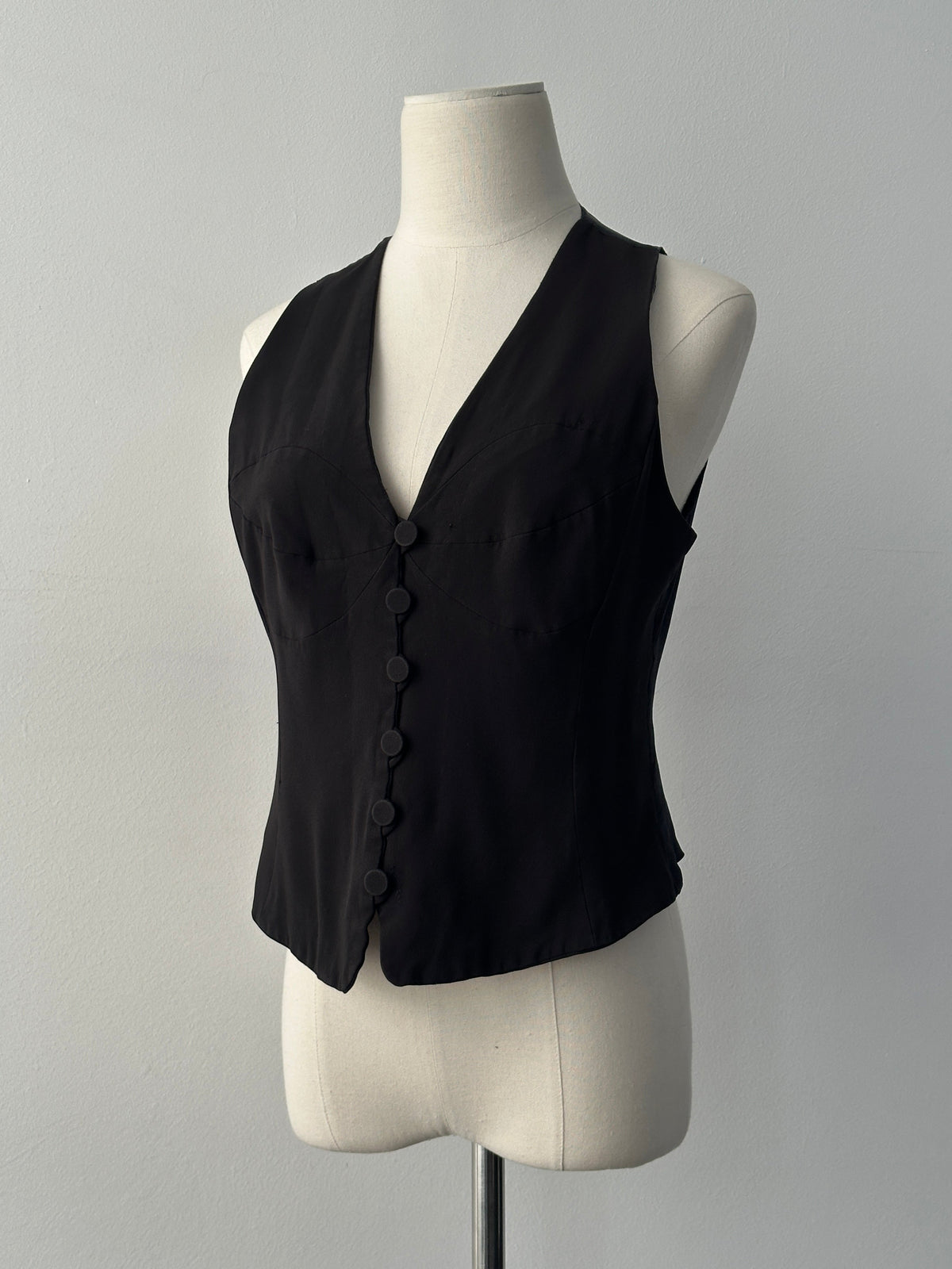 Emporio Armani 1990s fitted tailored single-button waistcoat in dark fabric, showcasing classic design and sleek silhouette.