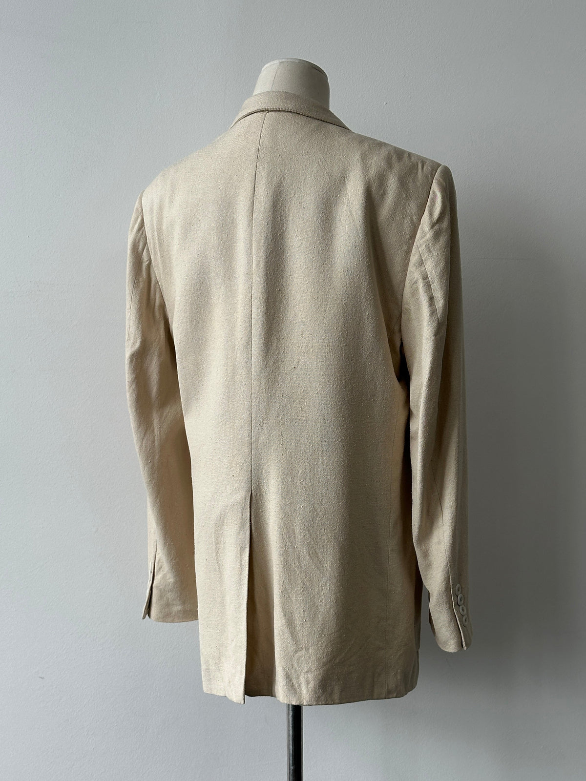 Christian Dior 1980s pure silk single-breasted blazer, navy blue with tailored fit and classic lapel, displayed on a hanger.
