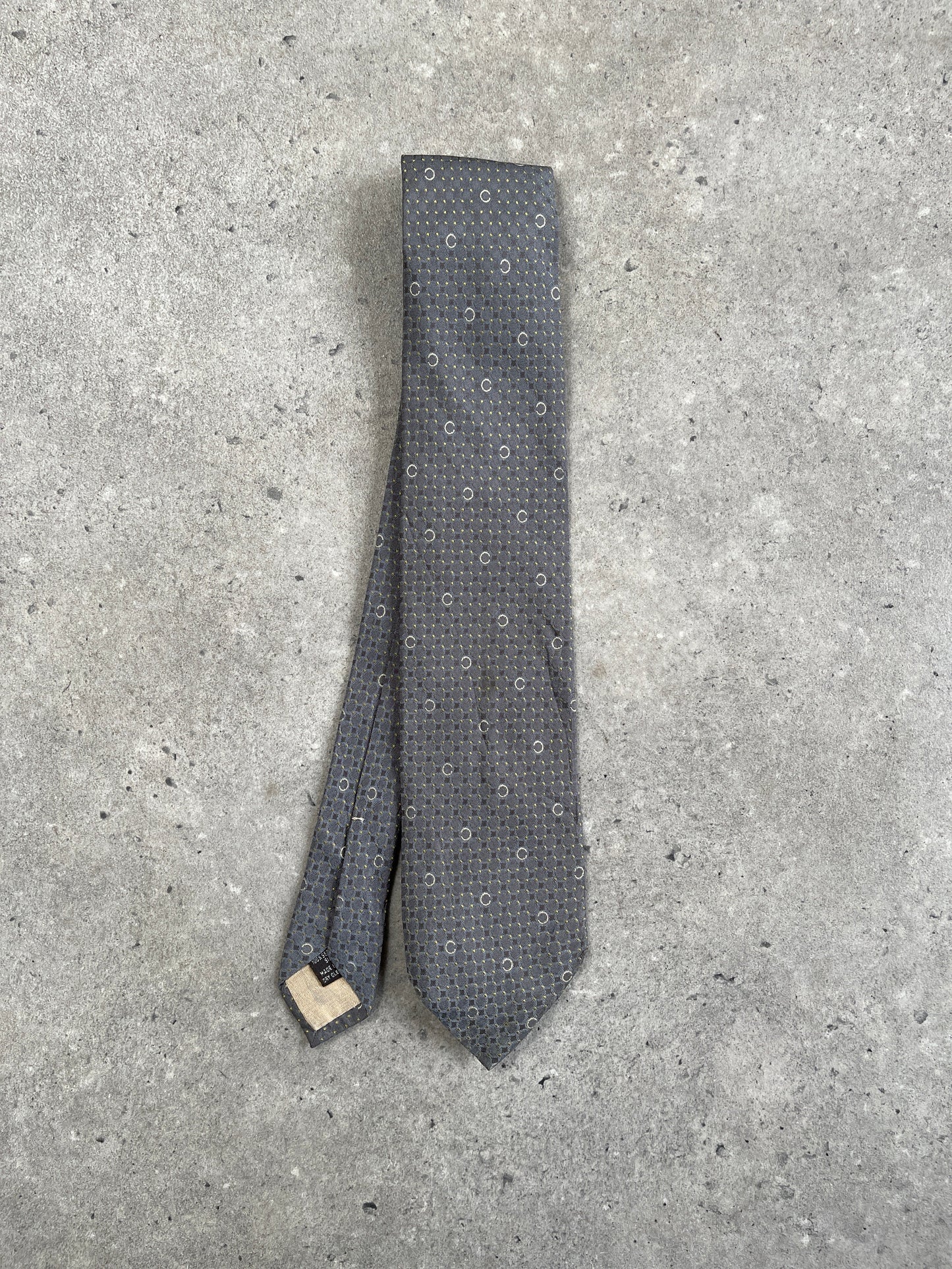 Celine 1990s pure silk woven monogram tie with intricate pattern, classic accessory for formal or professional attire.