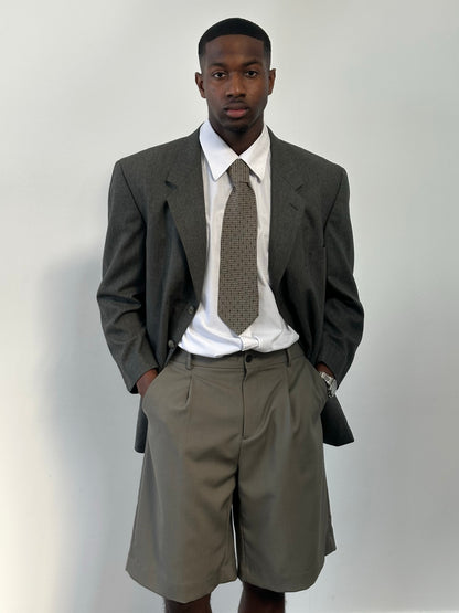 Yves Saint Laurent Pour Homme 1990s pure wool single-breasted blazer in size 46R, shown on a hanger.