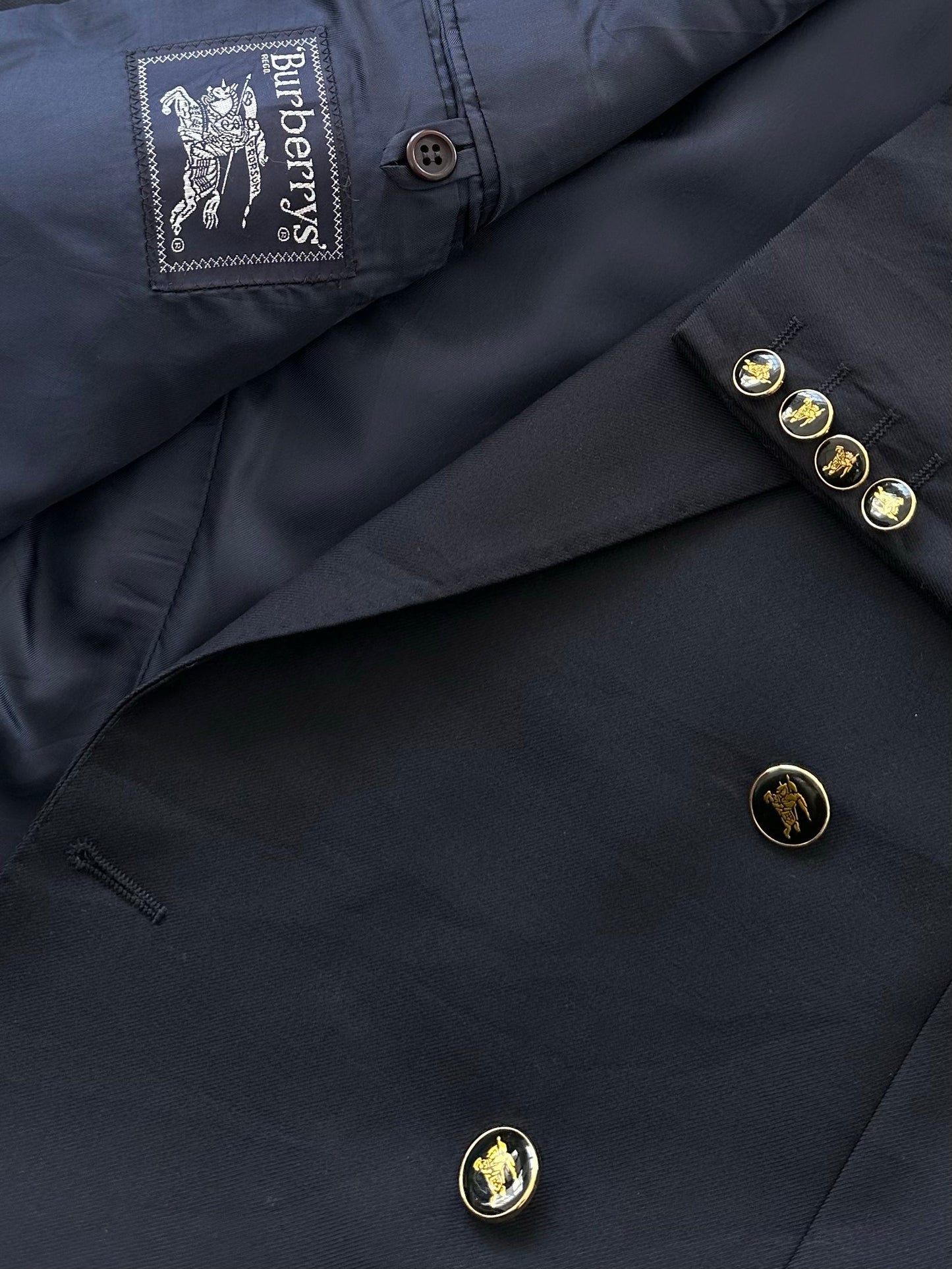 Burberry 1990s bespoke button wool double-breasted blazer in size 42R/XL, featuring classic tailoring and a tailored fit.
