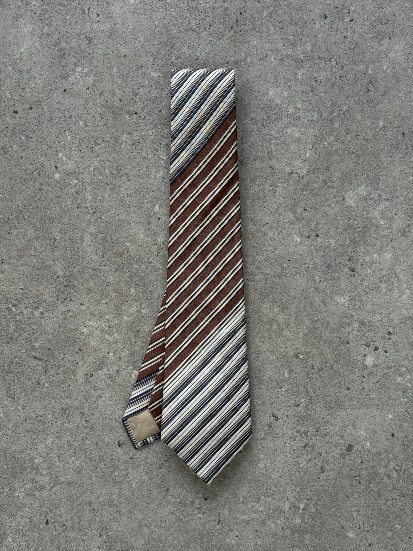 Christian Dior Monsieur 1990s pure silk striped tie, showing the elegant design and fabric detail in a close-up image.
