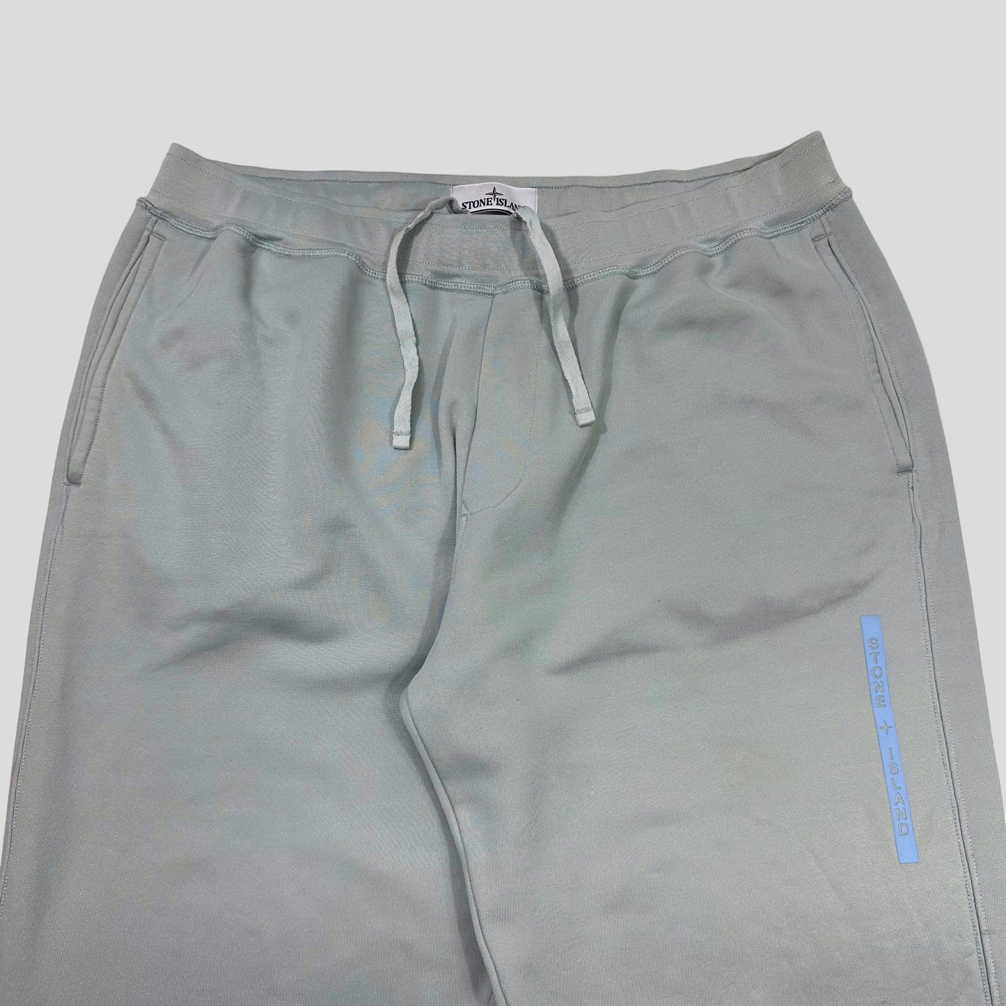 Stone Island AW22 Micrographic Spellout Logo Baby Blue Joggers - XL | Default Title, Blue
