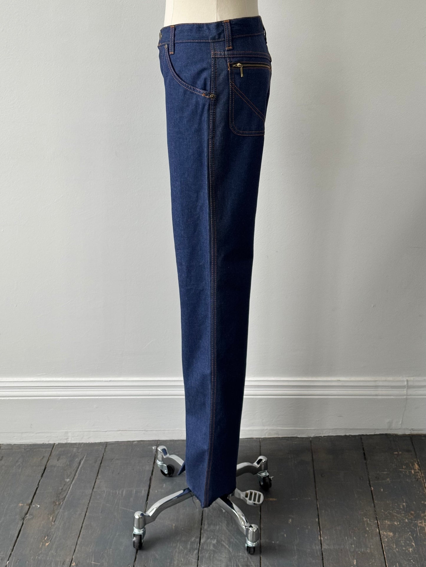 Vintage Italian 1990s high-waisted straight-leg denim jeans in size W28, showing classic vintage denim fabric and fit.