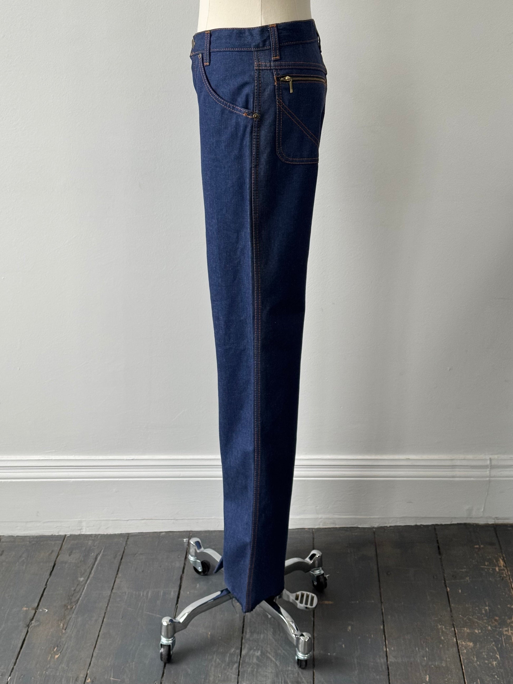 Vintage Italian 1990s high-waisted straight-leg denim jeans in size W28, showing classic vintage denim fabric and fit.