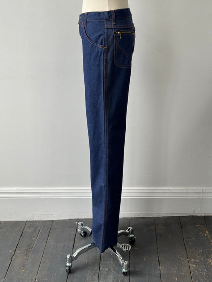 Vintage Italian 1990s high-waisted straight-leg denim jeans in size W28, showing classic vintage denim fabric and fit.